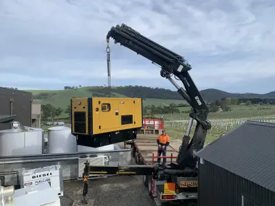 egh-pic-black-crane-lifts-yellow-generator-onto-4x3-2560x1920.webp