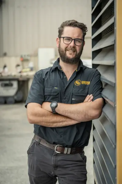 egh-pic-james-man-black-shirt-yellow-logo-dark-2x3-1707x2560.webp