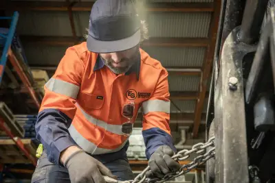egh-pic-man-orange-blue-work-shirt-wearing-3x2-2560x1707.webp