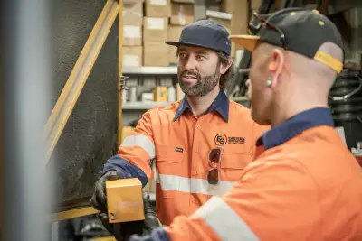 egh-pic-men-orange-shirts-dark-caps-warehouse-3x2-2560x1707.webp