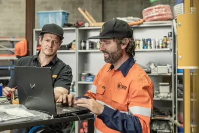 egh-pic-men-work-attire-table-laptop-papers-3x2-2560x1707.webp
