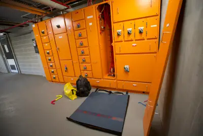 egh-pic-orange-electrical-panel-compartments-concrete-wall-3x2-2560x1707.webp