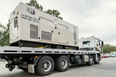 egh-pic-white-truck-flatbed-carries-large-generator-3x2-2560x1707.webp