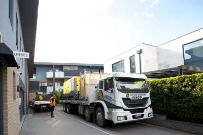 egh-pic-white-truck-yellow-logo-parked-city-3x2-2560x1706.webp