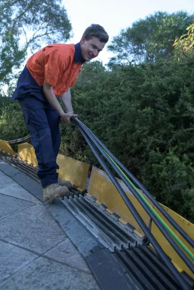 egh-pic-worker-orange-shirt-cable-ramp-2x3-1709x2560.webp